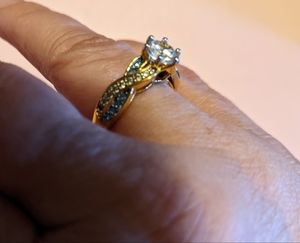 14k plated over sterling silver.  Simulated diamond and Blue Topaz ring.